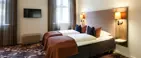 Dobbeltseng på hotelværelse på Hotel Vejlefjord